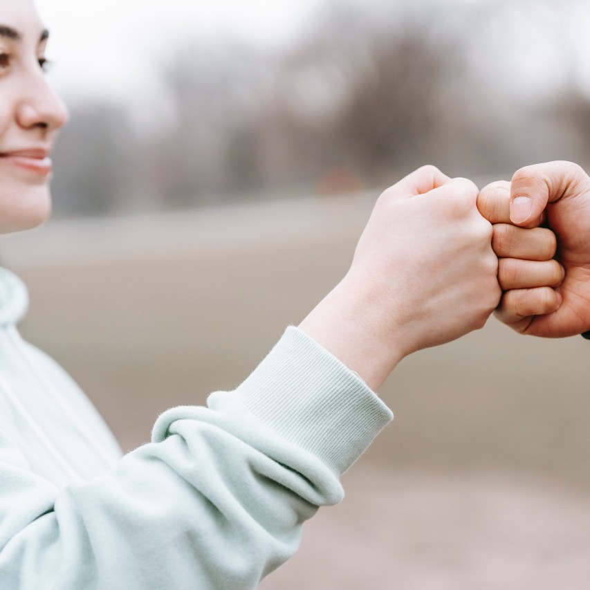 teen fist bump