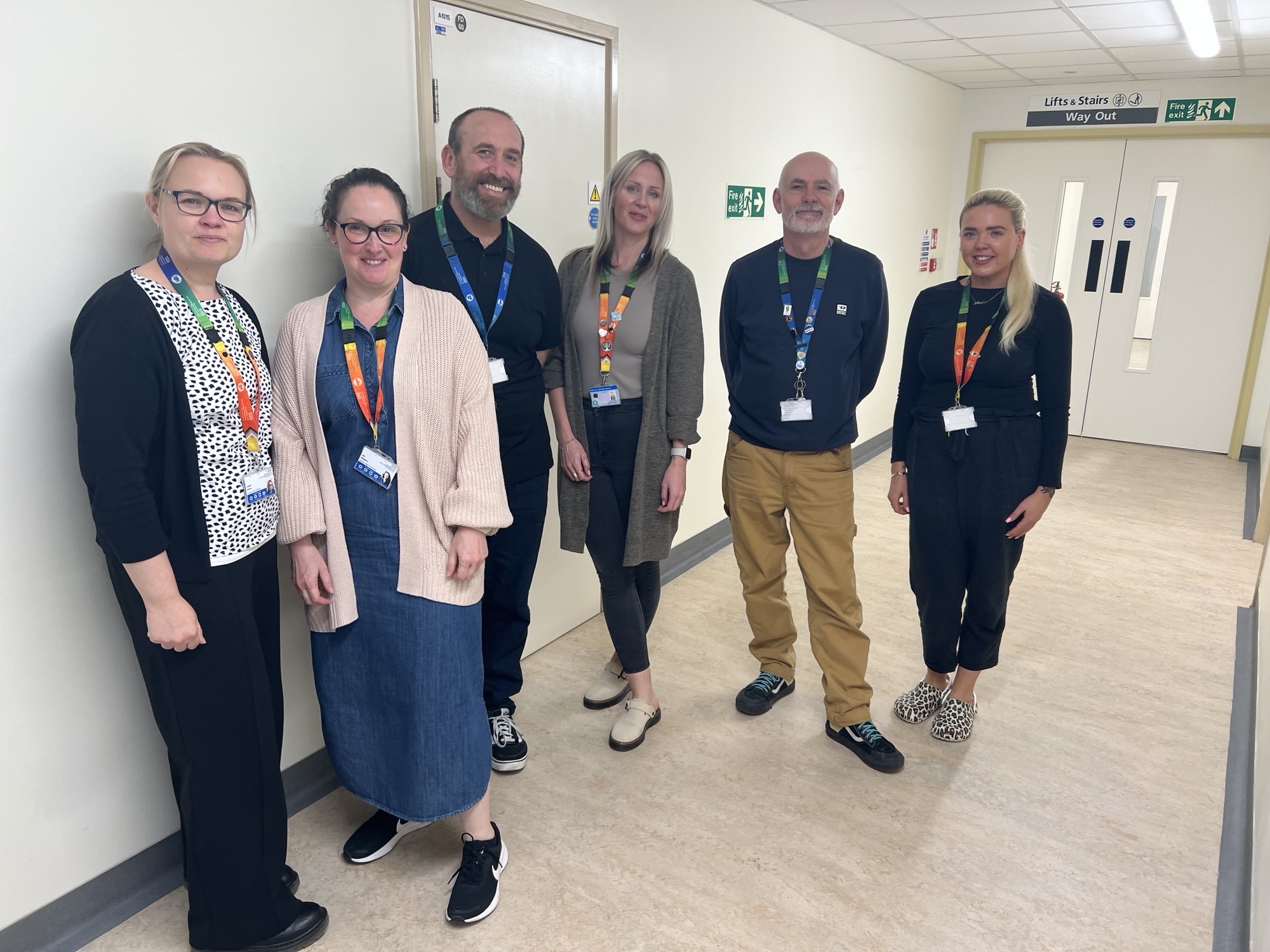 men and women from the portsmouth mental health hub team standing together in a row